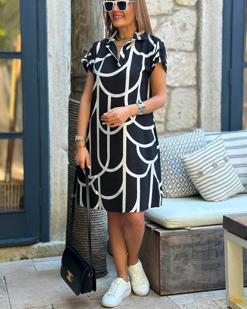 Nahia – Élégante robe midi à manches courtes avec rabat
