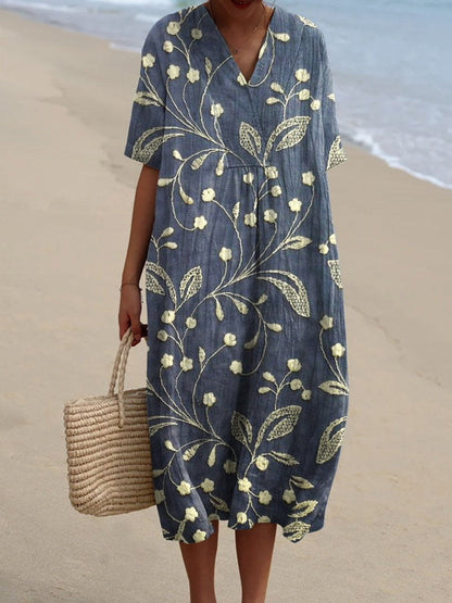 Méliane – Robe à fleurs bleu profond avec décolleté en V