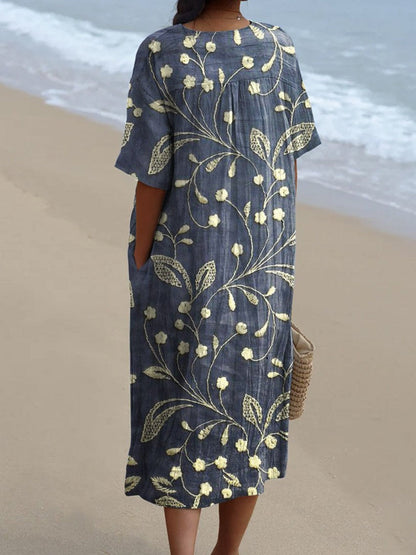 Méliane – Robe à fleurs bleu profond avec décolleté en V